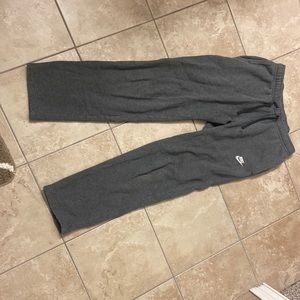 Nike dark grey sweatpants. Low condition. Rip in bottom. Other than that good.